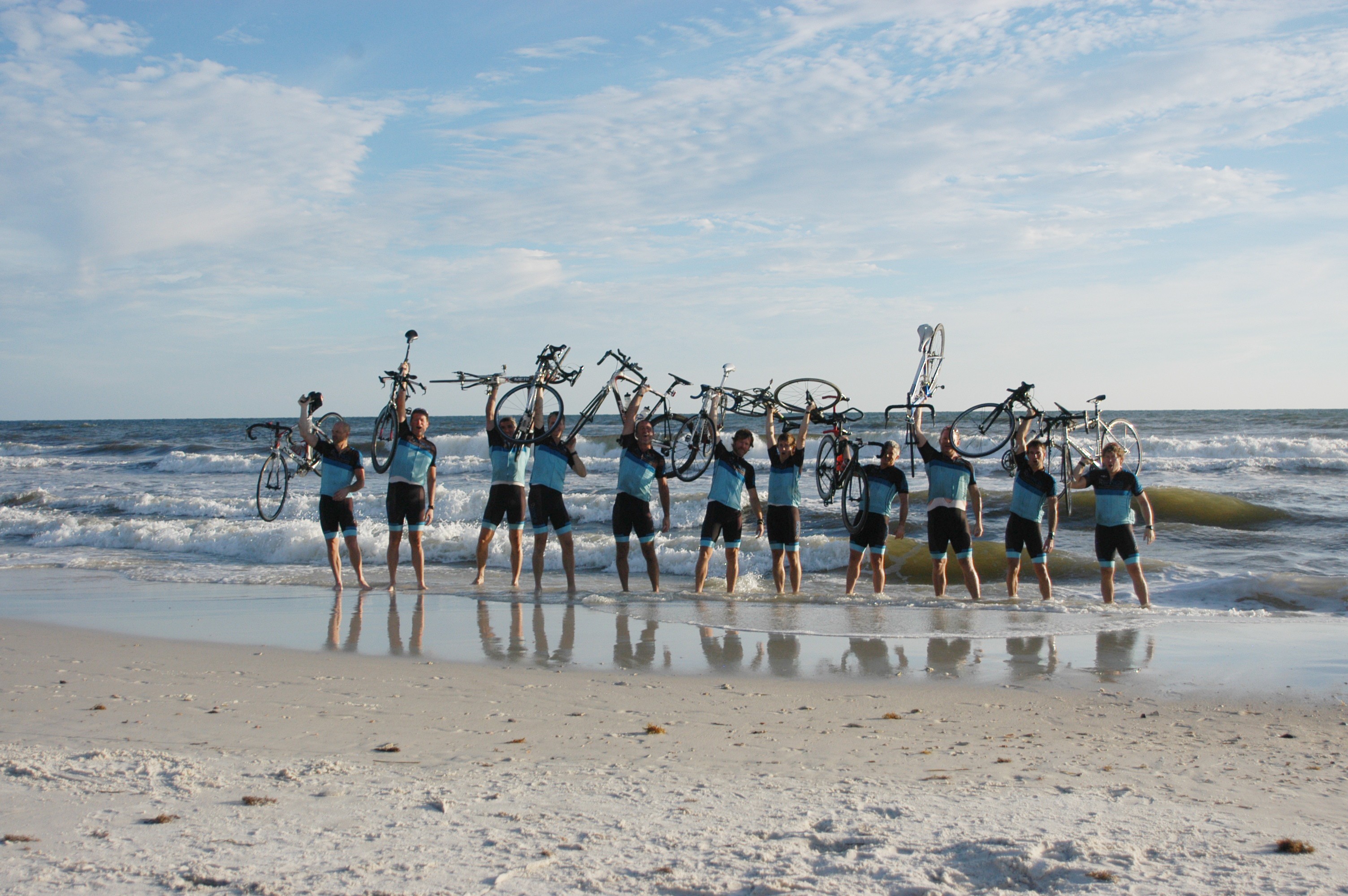 Riders lift their bikes in triumph after finishing a 500-mile bike ride from Memphis to a Florida beach
that raised money for and awareness of breast cancer. Dr. Brad Adkins is second from the right; Womans Clinic Administrator Jon Ewing is next to him, at far right.
